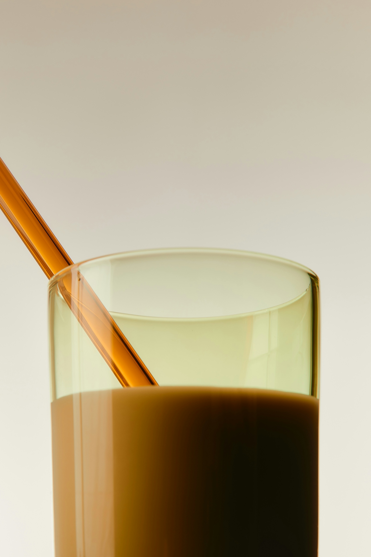 orange drink in glass with orange straw
