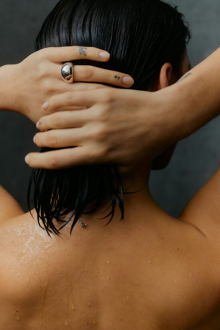 Woman washing hair in the shower